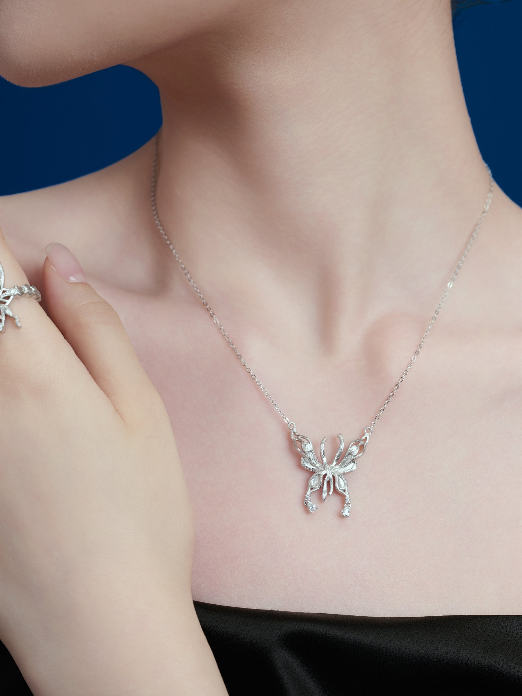 Silver Butterfly Pendant Necklace with Dainty Accents