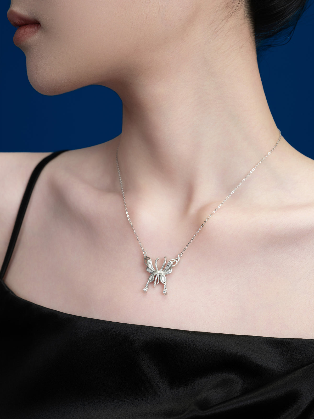 Silver Butterfly Pendant Necklace with Dainty Accents