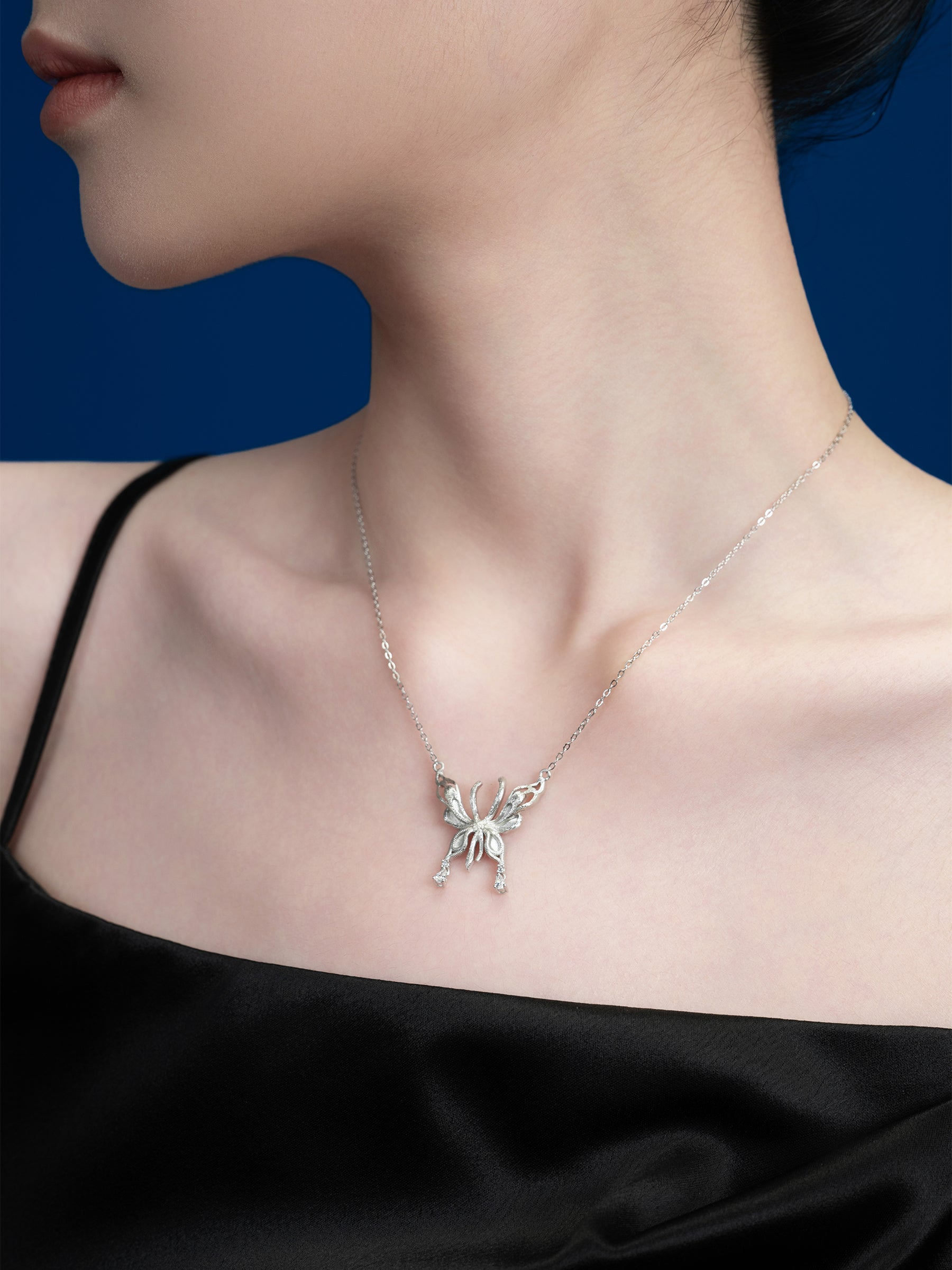 Silver Butterfly Pendant Necklace with Dainty Accents