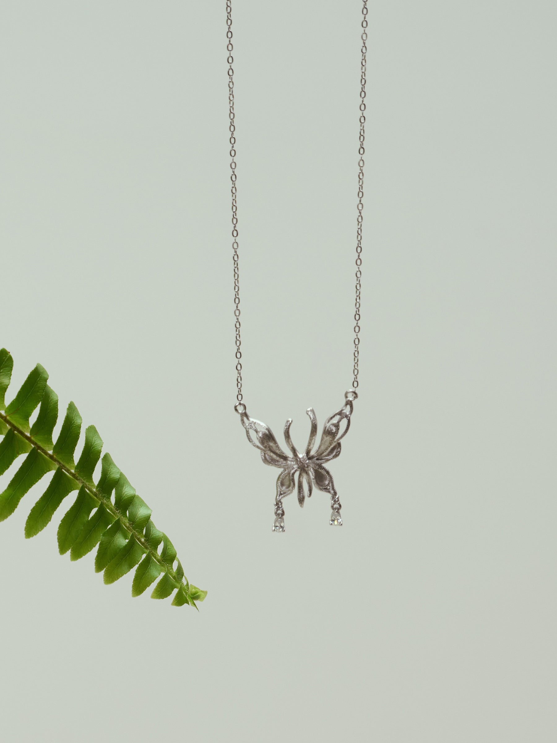 Silver Butterfly Pendant Necklace with Dainty Accents
